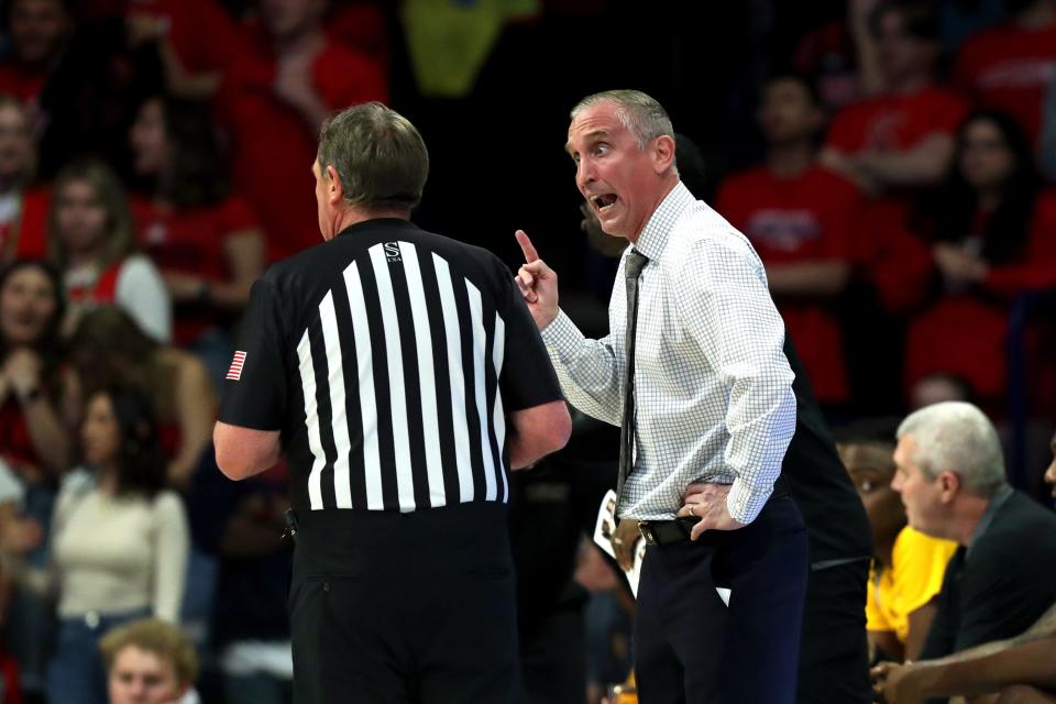 Arizona State Sun Devils head coach Bobby Hurley talks to the referee on the sidelines against the Arizona Wildcats during the first half at McKale Center in Tucson on Feb. 17, 2024.