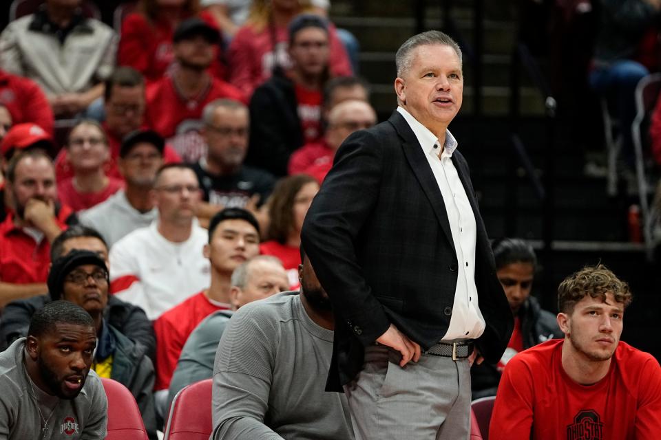 Nov 10, 2022; Columbus, OH, USA;  Ohio State Buckeyes head coach Chris Holtmann talks to his team during the second half of the NCAA men's basketball game against the Charleston Southern Buccaneers at Value City Arena. Ohio State won 82-56. Mandatory Credit: Adam Cairns-The Columbus Dispatch