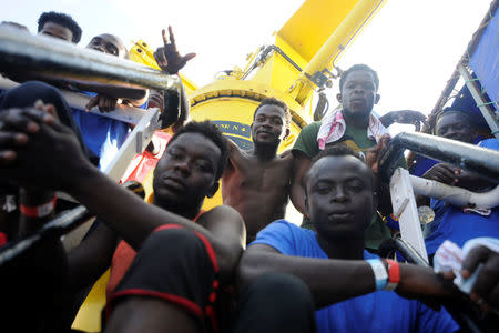 Migrants are seen resting on board of the MV Aquarius rescue ship run by SOS Mediterranee organisation and Doctors Without Borders during a search and rescue (SAR) operation in the Mediterranean Sea, off the Libyan Coast, August 12, 2018. REUTERS/Guglielmo Mangiapane