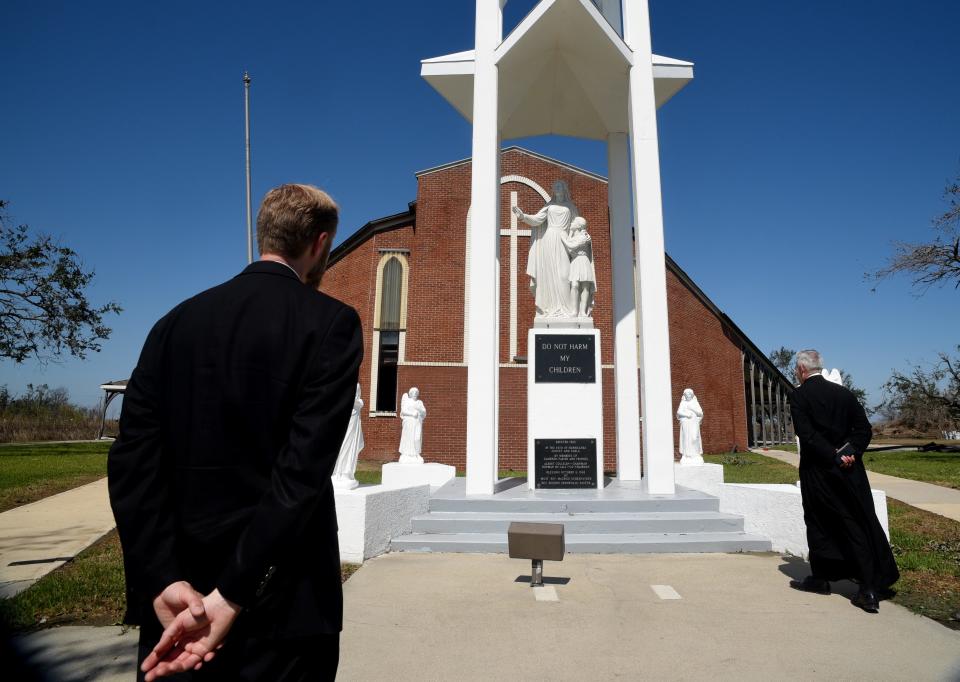 The Rev. D. B. Thompson and Canon Jean-Marie Moreau visit the shrine of Our Lady Star of the Sea Catholic Church in Cameron, Louisiana, on Oct.10.