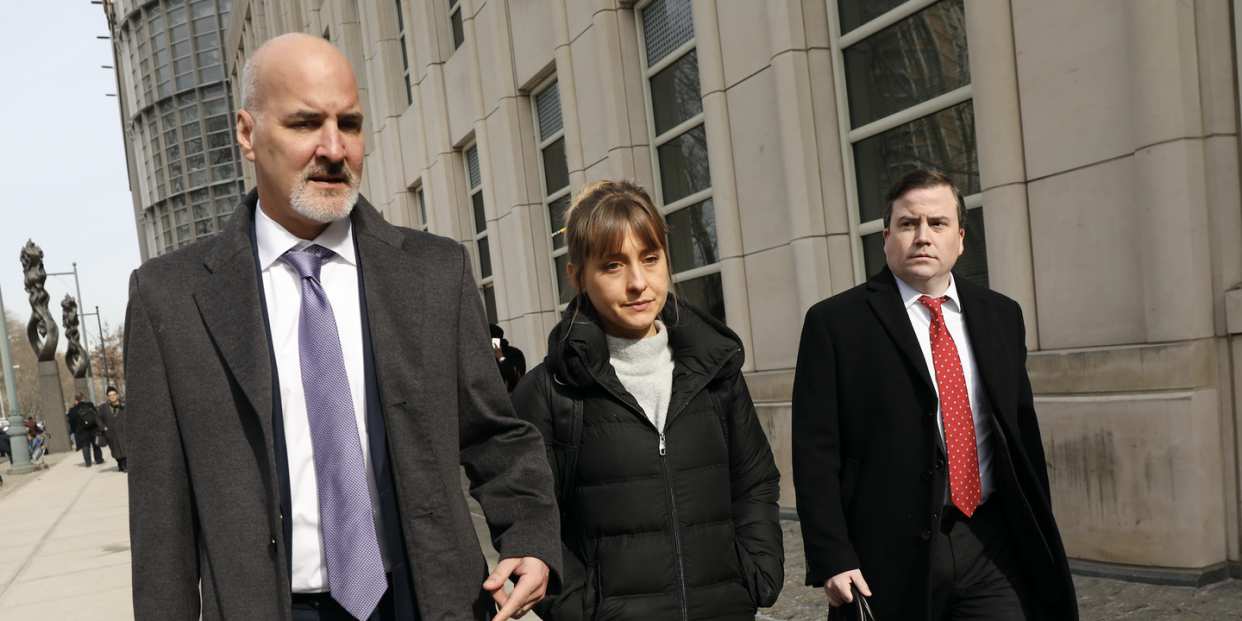 actress allison mack leaves the brooklyn federal courthouse with her lawyers after a court appearance surrounding the alleged sex cult nxivm on february 06, 2019 in new york city