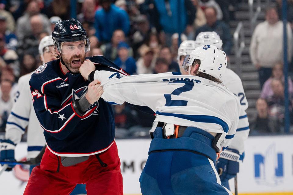 Dec 29, 2023; Columbus, Ohio, USA;
Columbus Blue Jackets defenseman Erik Gudbranson (44) fights with Toronto Maple Leafs defenseman Simon Benoit (2) during the second period of their game on Friday, Dec. 29, 2023 at Nationwide Arena.