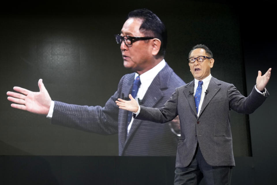 Toyota Motor Corp. Chief Executive Akio Toyoda delivers a speech on the stage at the Tokyo Auto Salon, an industry event similar to the world's auto shows Friday, Jan. 13, 2023, in Chiba near Tokyo. (AP Photo/Eugene Hoshiko)