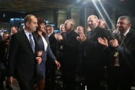 Presidential candidate of the Bulgarian Socialist Party Rumen Radev arrives for a news conference with his wife Desislava in Sofia, Bulgaria, November 13, 2016. Reuters/Marko Djurica