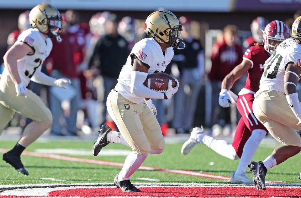 Nov 26, 2022; Amherst, Massachusetts, USA; Army Black Knights defensive back Jaydan Mayes (15) returns an interception against the Massachusetts Minutemen during the second half at Warren McGuirk Alumni Stadium.