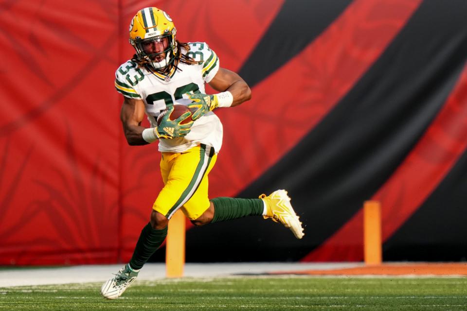 Green Bay Packers running back Aaron Jones (33) catches a pass out of the backfield In the first quarter during a Week 1 NFL preseason game between the Green Bay Packers and the Cincinnati Bengals, Friday, Aug. 11, 2023, at Paycor Stadium in Cincinnati.