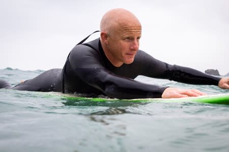 Tom Kay, founder of sustainable outdoor wear brand Finisterre, tests the prototype of what they believe is the world's first recyclable wetsuit, in Cornwall