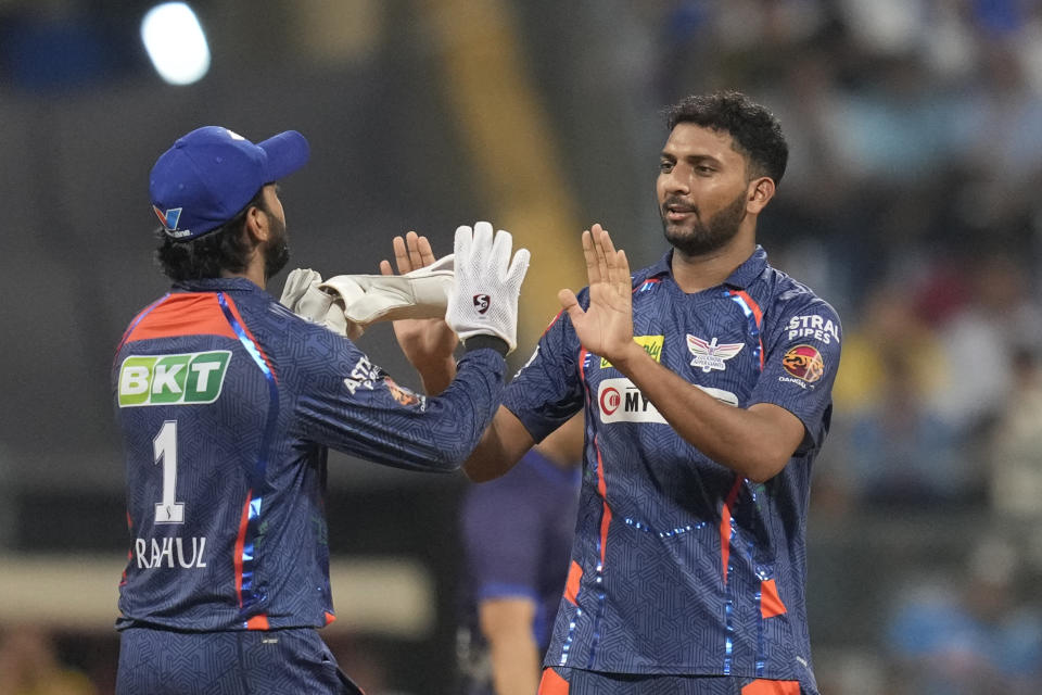 Lucknow Super Giants' Naveen-ul-Haq,right, celebrates the dismissal of Mumbai Indians' captain Hardik Pandya during the Indian Premier League cricket match between Mumbai Indians and Lucknow Super Giants in Mumbai, India, Friday, May 17, 2024.(AP Photo/ Rafiq Maqbool)