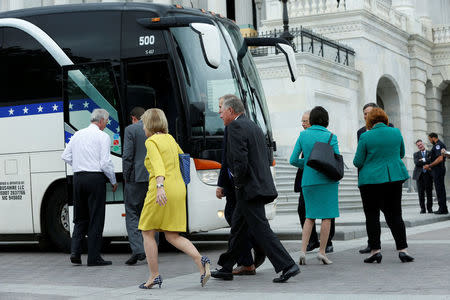 Senators board a bus to leave from Capitol Hill to attend a North Korea briefing at the White House. REUTERS/Yuri Gripas