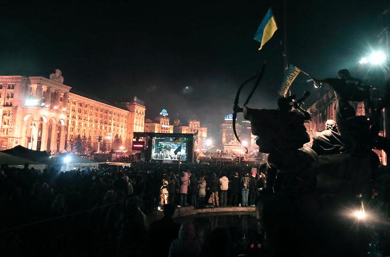 People gather on Independence square in Kiev to hear the line-up of the new pro-Western cabinet on February 26, 2014