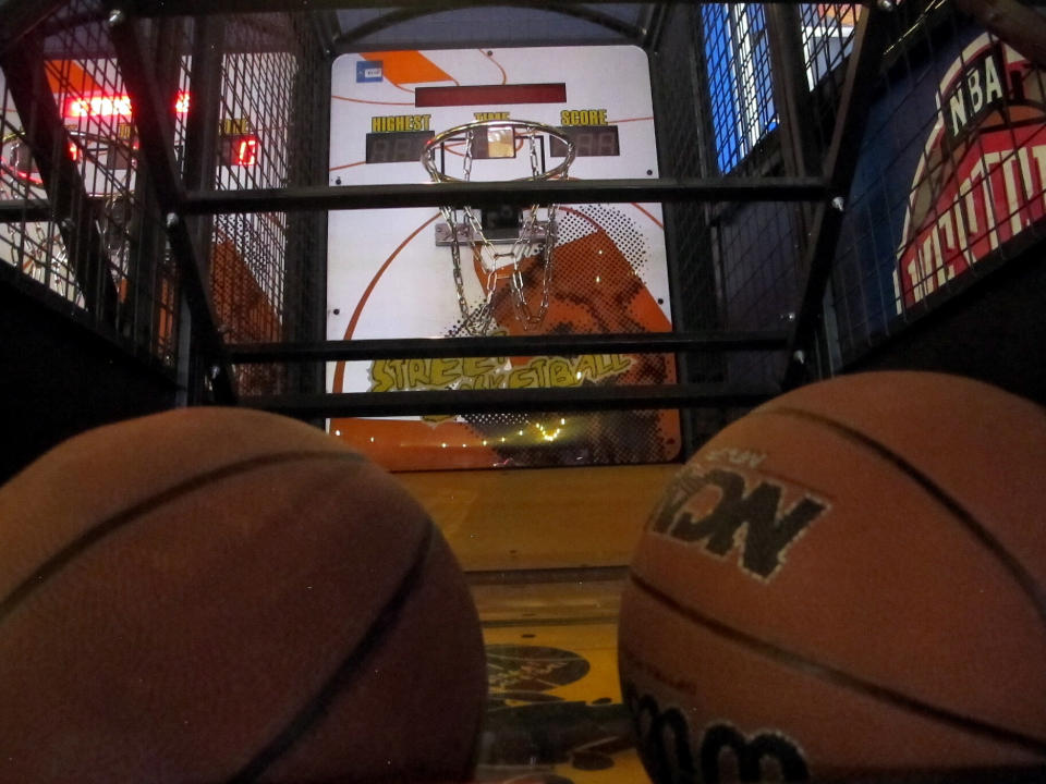 A basketball-shooting game sits inside the soon-to-open Lucky Snake arcade, Wednesday, April 21, 2021, at the former Showboat casino in Atlantic City, N.J. Philadelphia developer Bart Blatstein is spending nearly $130 million on attractions at the former Atlantic City casino including an indoor water park; a retractible domed concert hall, a beer garden and a Boardwalk sun deck to increase family entertainment options in Atlantic City. (AP Photo/Wayne Parry)