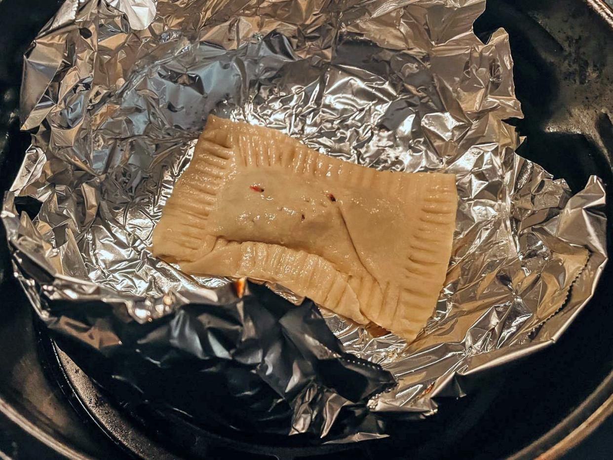 toaster pastry on a sheet of aluminum foil in an air fryer