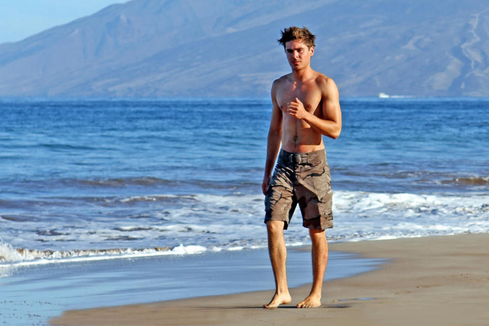 <p>This is Zac Efron taking a walk at the beach.</p>