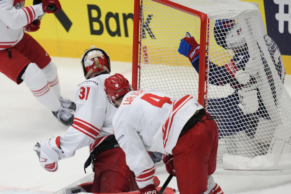 Unted States' Brady Tkachuk, right, scores his side's second goal during the preliminary round match between Poland and United States at the Ice Hockey World Championships in Ostrava, Czech Republic, Friday, May 17, 2024. (AP Photo/Darko Vojinovic)