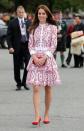 <p>It was another Alexander McQueen day for the Duchess in Vancouver as she appeared in a red-and-white printed design with a royal red Miu Miu clutch and gorgeous suede heels. <i>[Photo: PA]</i> </p>