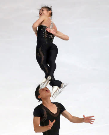 FILE PHOTO: Figure Skating - Olympic Qualifying ISU Challenger Series - Pairs Free Skating - Oberstdorf, Germany - September 29, 2017 - Ryom Tae-Ok and Kim Ju-Sik of North Korea compete. REUTERS/Michael Dalder/File Photo