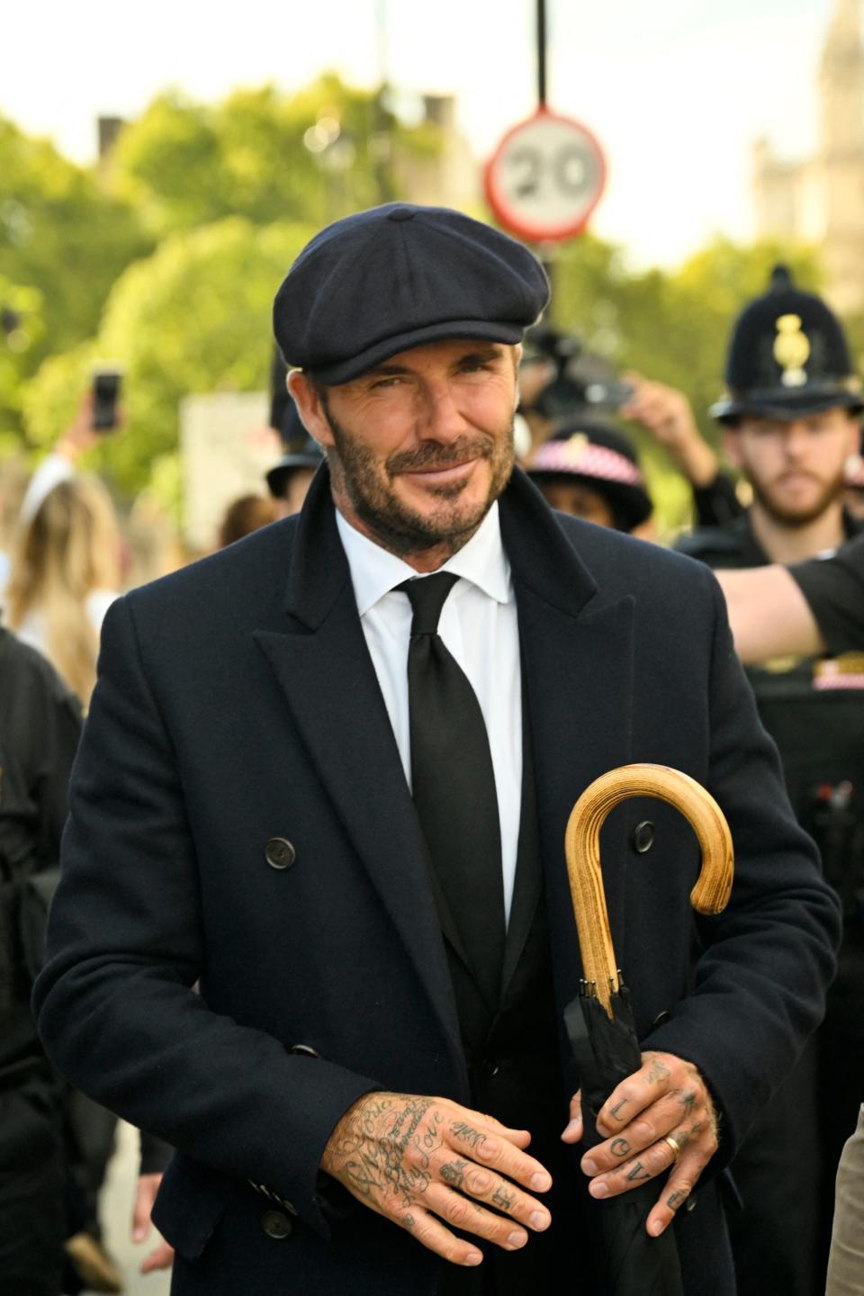 David Beckham (pictured) leaves Westminster Hall.