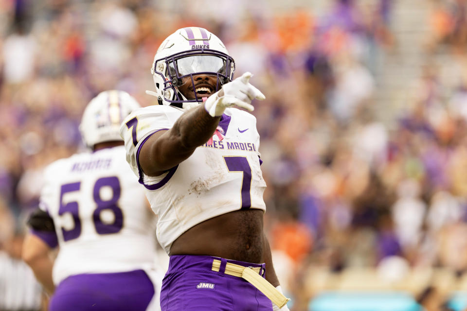 CHARLOTTESVILLE, VIRGINIA - SEPTEMBER 9: Ty Son Lawton #7 of the James Madison Dukes celebrates a touchdown in the second half during a game against the Virginia Cavaliers at Scott Stadium on September 9, 2023 in Charlottesville, Virginia. (Photo by Ryan M. Kelly/Getty Images)