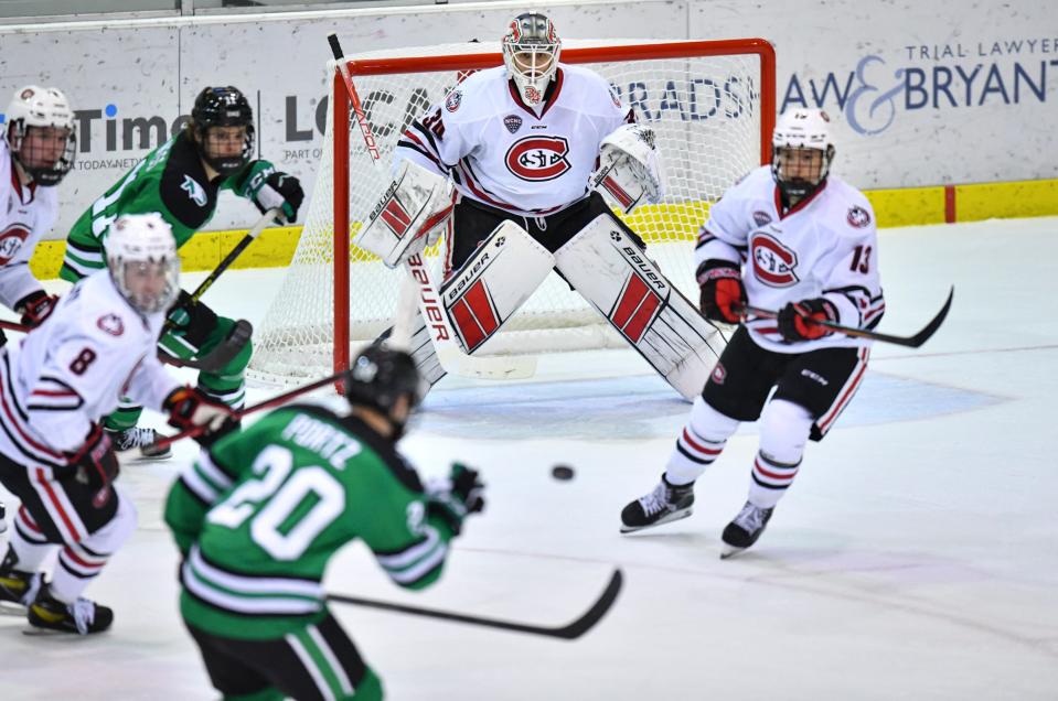 St. Cloud State goaltender David Hrenak watches as the puck bounces in front of him during the first period of the game Friday, Dec. 3, 2021, against North Dakota at the Herb Brooks National Hockey Center in St. Cloud.