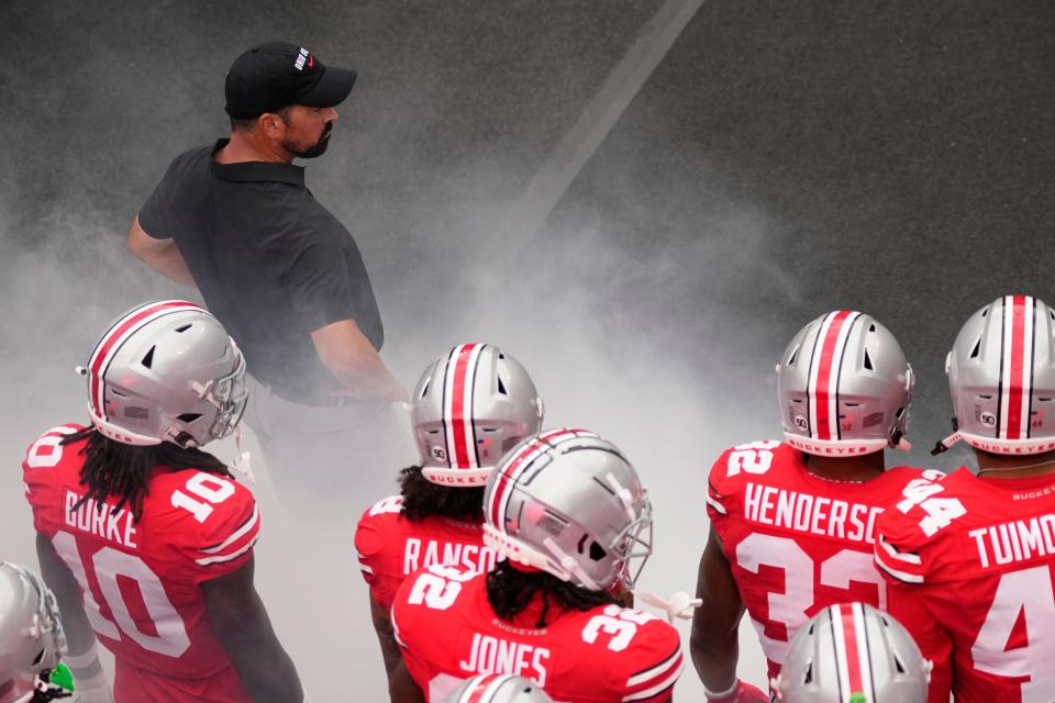 Aug 31, 2024; Columbus, OH, USA; Ohio State Buckeyes head coach Ryan Day leads his team onto the field prior to the NCAA football game against the Akron Zips at Ohio Stadium.