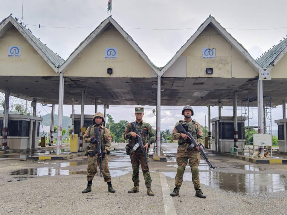 In this handout photo provided by Mandalay People's Defence Force, members of the Ta'ang National Liberation Army, one of the ethnic armed forces in the Brotherhood Alliance, and the Mandalay People's Defence Force pose for a photograph in front of the captured toll-gate in Nawnghkio township in Shan state, Myanmar, June 26, 2024. New fighting has broken out in northeastern Myanmar, bringing an end to a Chinese-brokered cease-fire and putting pressure on the military regime as it faces attacks from resistance forces on multiple fronts in the country's civil war. (Mandalay People's Defence Force via AP)