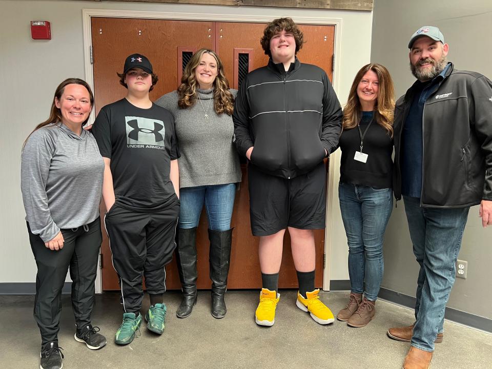 Friend and Gofundme starter Kara Pattison, left, and Hometown Life reporter Susan Bromley, second from right, with the Kilburn family: Graesyn, Rebecca, Eric Jr. and Eric Sr.