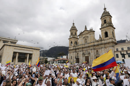 People take part in a rally against violence, following a car bomb explosion, in Bogota, Colombia January 20, 2019. REUTERS/Luisa Gonzalez