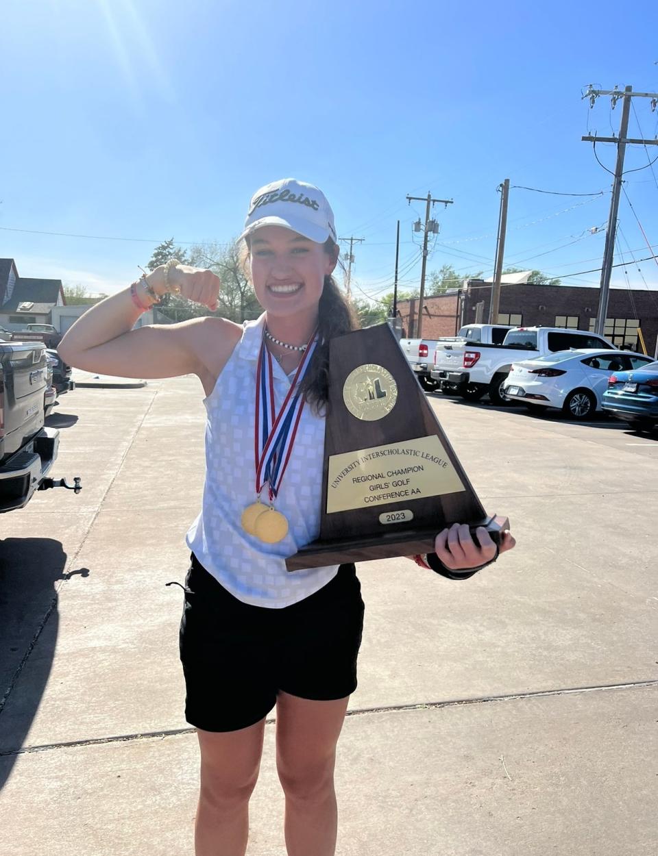 Memphis' Maggie Cook flexes after winning the 2A Region 1 title in 2023.