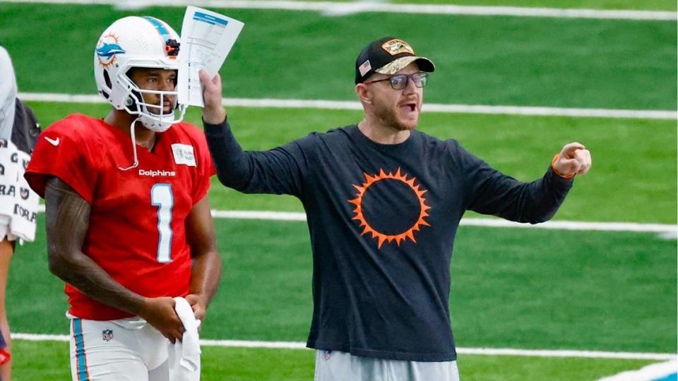 Miami Dolphins quarterbacks and passing game coordinator coach Darrell Bevell works with quarterback Tua Tagovailoa (1) during practice drills at the Baptist Health Training Complex in Miami Gardens on Wednesday, August 23, 2023.