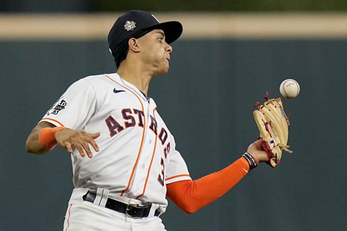 Houston Astros shortstop Jeremy Pena catches a fly ball hit by Philadelphia Phillies' Rhys Hoskins during the ninth inning in Game 1 of baseball's World Series between the Houston Astros and the Philadelphia Phillies on Friday, Oct. 28, 2022, in Houston. (AP Photo/Eric Gay)