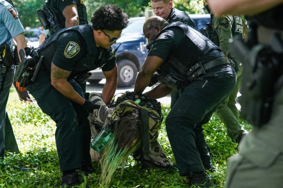 Police arrest a demonstrator during a pro-Palestinian protest at Emory University on 25 April. Police arrested some 20 students at the Georgia school (AFP via Getty Images)