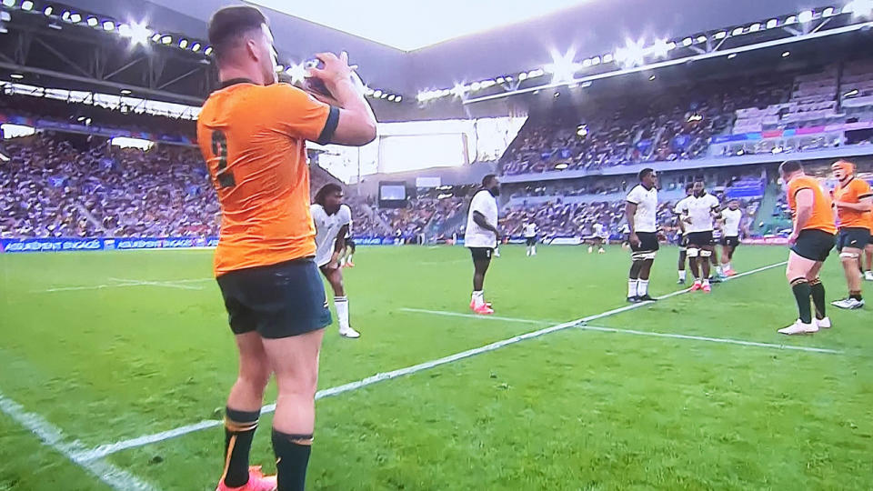 Wallabies hooker Dave Porecki throwing the ball in for a lineout.
