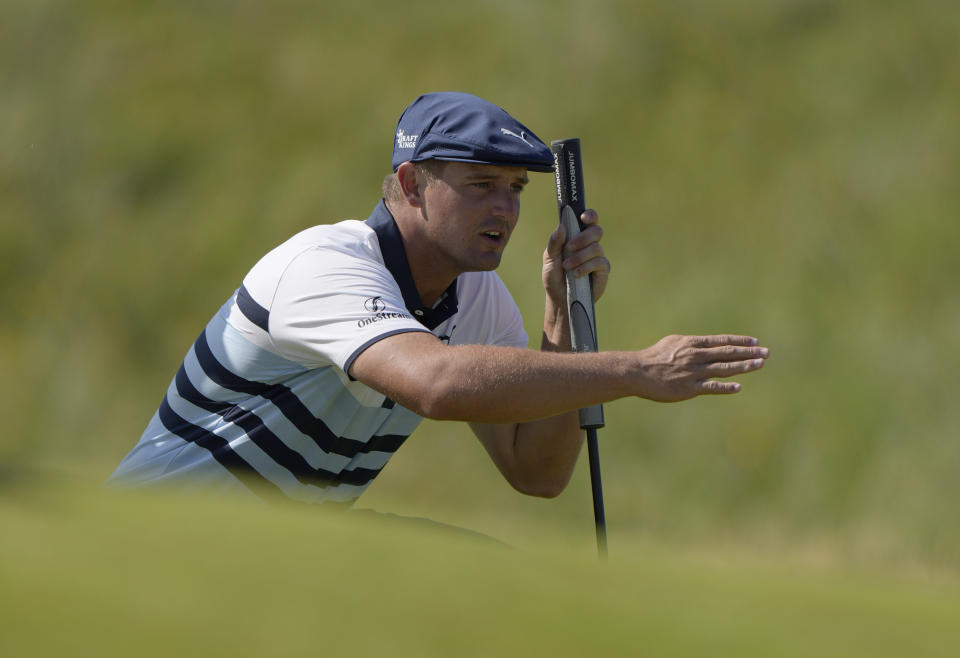 FILE - In this July 17, 2021, file photo, United States' Bryson DeChambeau gestures as he lines up his putt on the 2nd green during the third round of the British Open Golf Championship at Royal St George's golf course Sandwich, England. DeChambeau has tested positive for COVID-19 before leaving the United States for the Olympics and will miss the Tokyo Games. He’ll be replaced by Patrick Reed. (AP Photo/Alastair Grant, File)