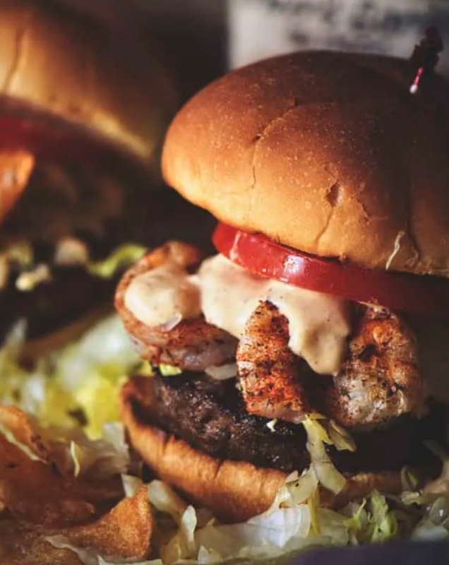 <p>Pass the Sushi</p><p>This shrimp po-boy burger is a cajun-spiced all-beef patty with spicy grilled shrimp topped with shredded lettuce, tomato and a zesty remoulade sauce.</p><p><strong>Get the recipe: <a href="https://passthesushi.com/shrimp-po-boy-burgers-farmtojar/" rel="nofollow noopener" target="_blank" data-ylk="slk:Shrimp Po' Boy Burgers;elm:context_link;itc:0;sec:content-canvas" class="link ">Shrimp Po' Boy Burgers</a></strong></p>