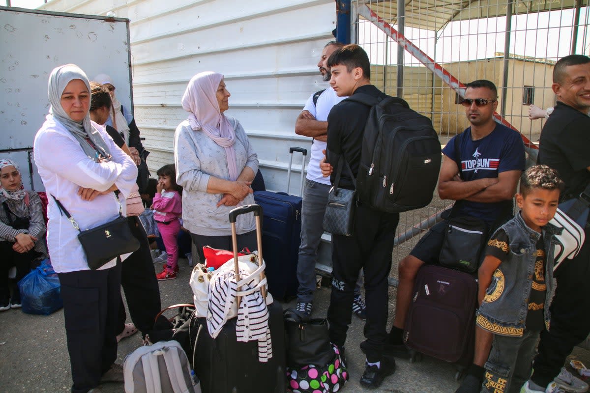 Foreign citizens wait at the Rafah crossing to be allowed to travel on October 21, 2023 in Rafah, Gaza (Getty Images)
