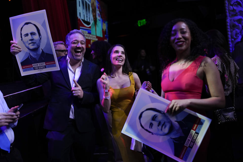 Supporters of U.S. Rep. Adam Schiff, D-Calif., a U.S. Senate candidate, hold images with his likeness at an election night party, Tuesday, March 5, 2024, in Los Angeles. (AP Photo/Jae C. Hong)