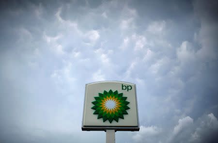 Storm clouds form near a BP station in Alexandria, Virginia July 19, 2010. REUTERS/Molly Riley