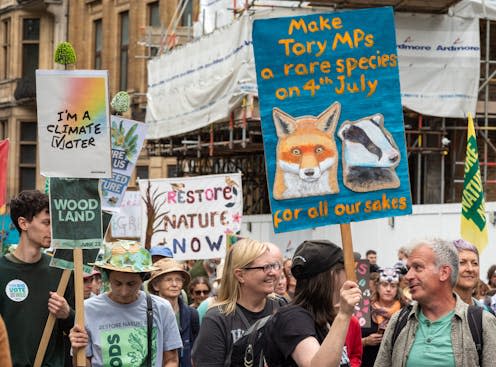 <span class="caption">A pre-election march in London demanding nature restoration.</span> <span class="attribution"><a class="link " href="https://www.shutterstock.com/image-photo/london-uk-jun-22-2024-environmentalists-2479505331" rel="nofollow noopener" target="_blank" data-ylk="slk:Andy Soloman/Shutterstock;elm:context_link;itc:0;sec:content-canvas">Andy Soloman/Shutterstock</a></span>