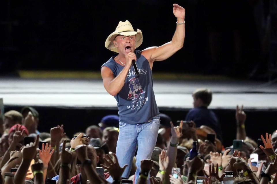 <p>Matthew J. Lee/The Boston Globe via Getty</p> Kenny Chesney performs in Foxborough in August 2018