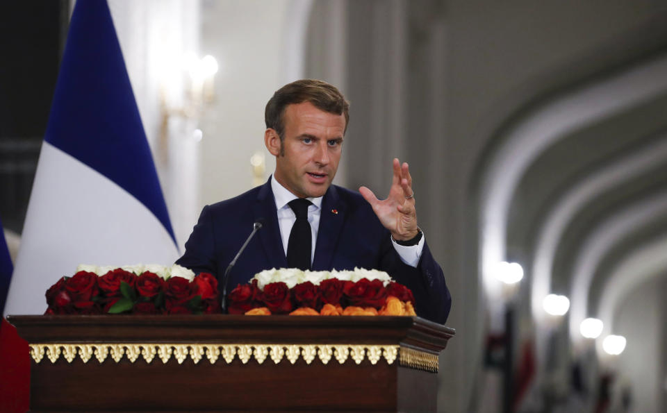 French President Emmanuel Macron speaks during a joint press conference with Iraqi President Barham Salih, at the Salam Palace Wednesday, Sept. 2, 2020 in Baghdad. French President Emmanuel Macron is the first head of state to visit the Iraqi capital since Prime Minister Mustafa al-Kadhimi, Iraq's former intelligence chief, formed a new government in May. (Gonzalo Fuentes/Pool via AP)