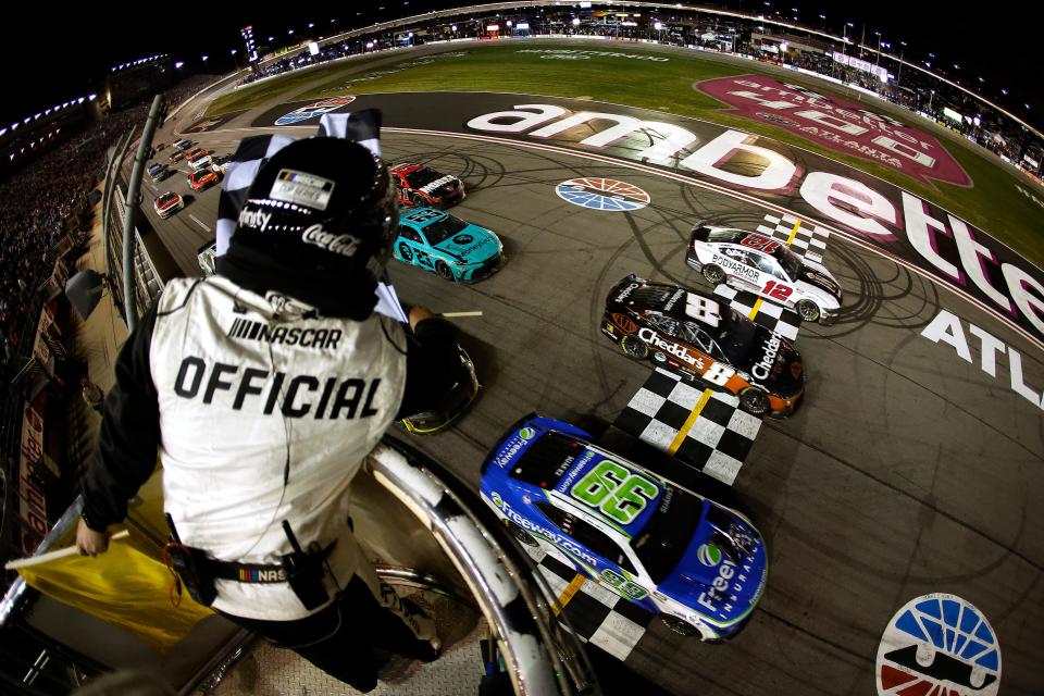 HAMPTON, GEORGIA - FEBRUARY 25: Daniel Suarez, driver of the #99 Freeway Insurance Chevrolet, crosses the finish line ahead of Kyle Busch, driver of the #8 Cheddar's Scratch Kitchen Chevrolet, and Ryan Blaney, driver of the #12 BodyArmor Zero Sugar Ford, to win the NASCAR Cup Series Ambetter Health 400 at Atlanta Motor Speedway on February 25, 2024 in Hampton, Georgia. (Photo by Alex Slitz/Getty Images) ORG XMIT: 776111357 ORIG FILE ID: 2038835323