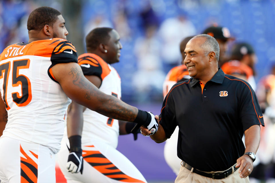 Head coach Marvin Lewis of the Cincinnati Bengals greets defensive tackle Devon Still #75 of the Cincinnati Bengals as he comes onto the field to take on the Baltimore Ravens at M&T Bank Stadium on September 10, 2012 in Baltimore, Maryland. (Photo by Rob Carr/Getty Images)