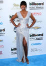 Celebrities in metallic fashion: Kelly Rowland showed off her figure in a silver Rami Al Ali SS13 Couture gown.