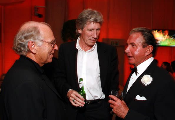 Jimmy Buffett, Roger Waters and George Hamilton during 2006 Vanity Fair Oscar Party Hosted by Graydon Carter at Morton's in Beverly Hills, California, United States. (Photo by E. Charbonneau/WireImage for Vanity Fair Magazine )