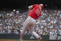 Los Angeles Angels' Mike Trout hits a two-run home run on a pitch from Seattle Mariners starting pitcher Logan Gilbert during the fourth inning of a baseball game Sunday, June 19, 2022, in Seattle. (AP Photo/John Froschauer)