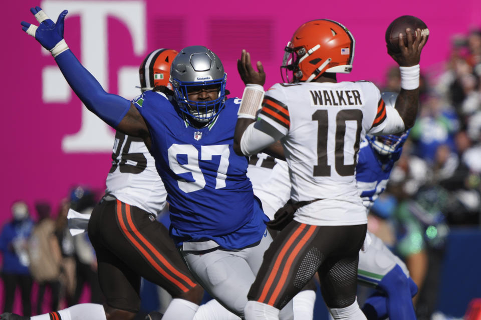 Cleveland Browns quarterback PJ Walker (10) is pressured by Seattle Seahawks defensive end Mario Edwards Jr. (97) in the first half of an NFL football game, Sunday, Oct. 29, 2023, in Seattle. (AP Photo/Ted S. Warren)