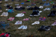 <p>Activists install 7000 shoes on the lawn in front of the U.S. Capitol on Capitol Hill in Washington, U.S. March 13, 2018. Organizers said the installation represents the number of lives lost since the shooting at Sandy Hook elementary in Newtown, Connecticut. (Photo: Eric Thayer/Reuters) </p>