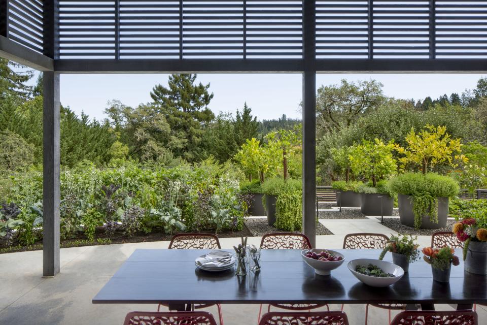 An outdoor space with colorful chairs