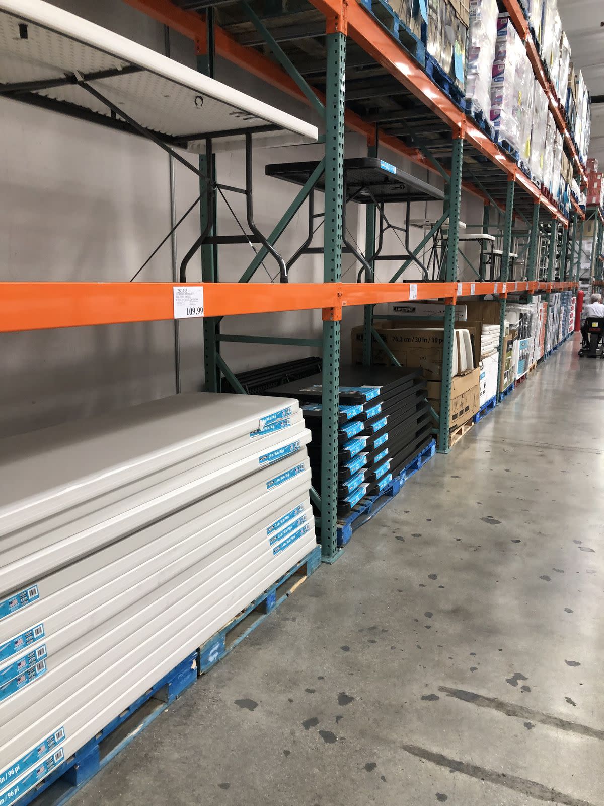 A Costco Business Center interior shot showing folding tables stacked.
