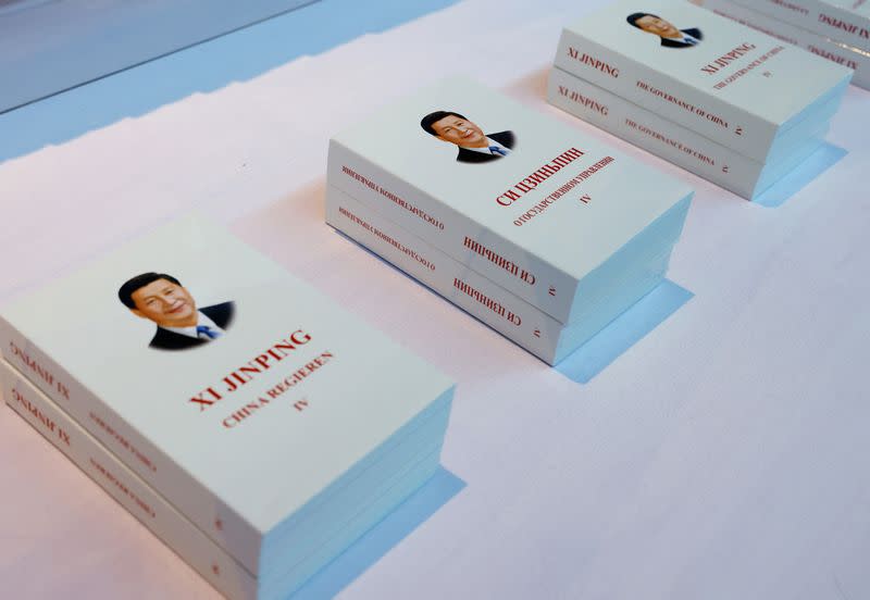 Copies of "Xi Jinping: The Governance of China" in Russian are displayed outside the media center ahead of the Third Belt and Road Forum in Beijing